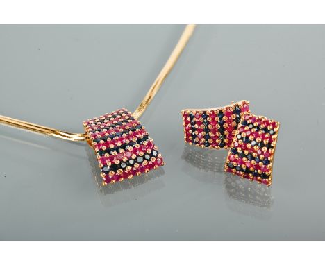 EASTERN GOLD RUBY AND SAPPHIRE PENDANT ON CHAIN
the pendant of tapered form with grain set circular stones, on a chain; along