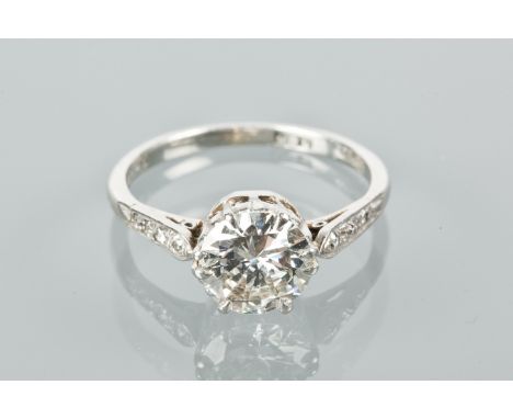 DIAMOND SOLITAIRE RING
the brilliant cut diamond approximately 1.50 carats, on diamond shoulders, marked 'PLAT' for platinum,