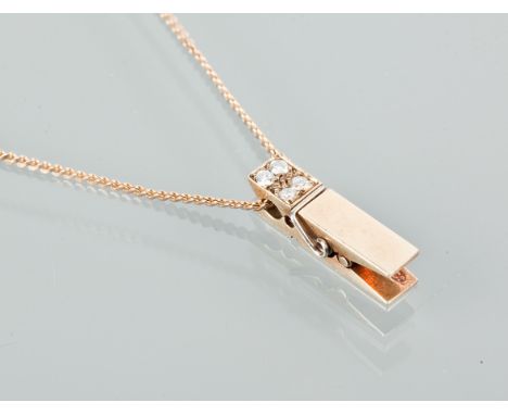 GOLD DIAMOND SET PEG MOTIF PENDANT ON CHAIN
set with four diamonds, on a nine carat gold chain