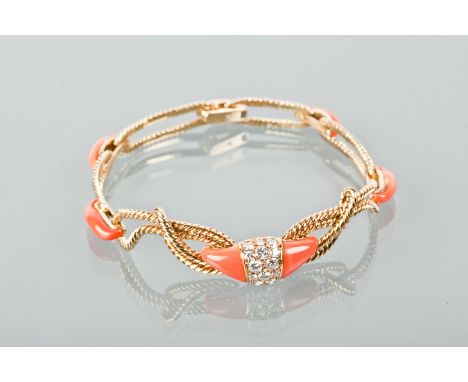 CORAL AND DIAMOND BRACELET
with a central section of brilliant cut diamonds, flanked by two sections of coral, on a knotted r