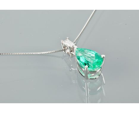 EMERALD AND DIAMOND PENDANT
set with a pear cut emerald of approximately 1.48 carats, below and baguette diamond, marked 950 