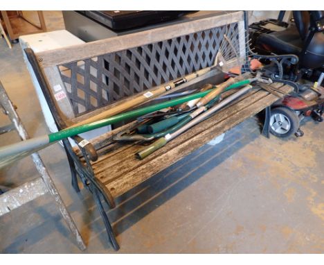 Garden bench with metal lattice back panel