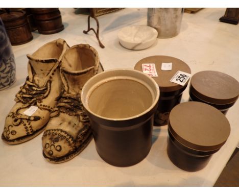 Pair of ceramic boots and four Denby storage jars