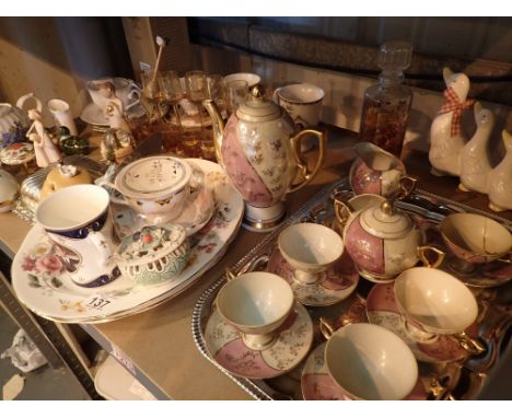 Shelf of mixed ceramics and glass 