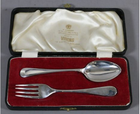 A cased silver spoon and fork christening set, assayed Sheffield 1964.
