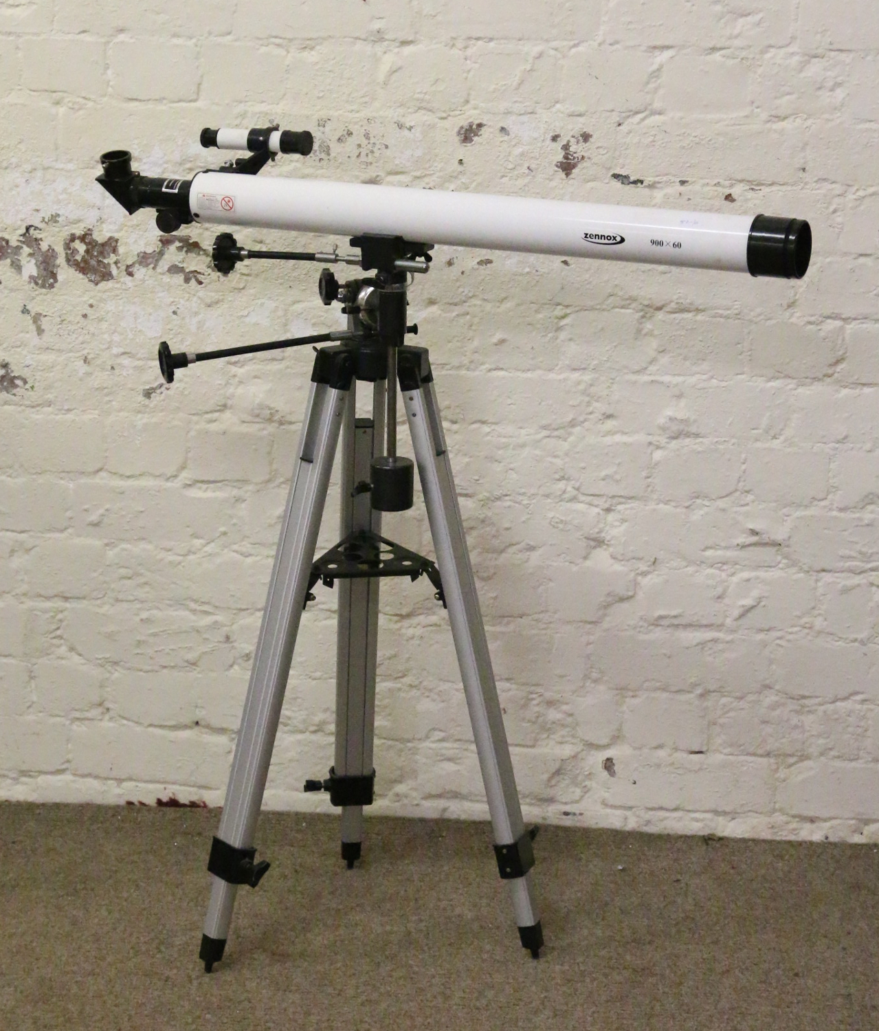 A Zennox 900x60 telescope on tripod.