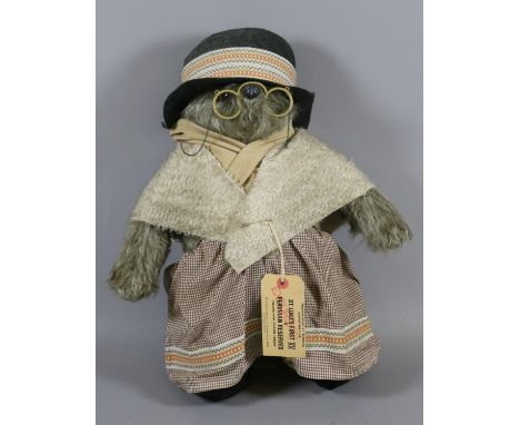 A soft toy model of Aunt Lucy complete with hat, shoes, glasses and scarf, etc.