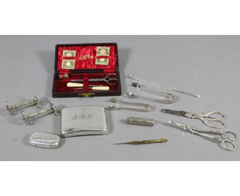 A box of silver plated items including vesta case, cigarette case and grape scissors etc.