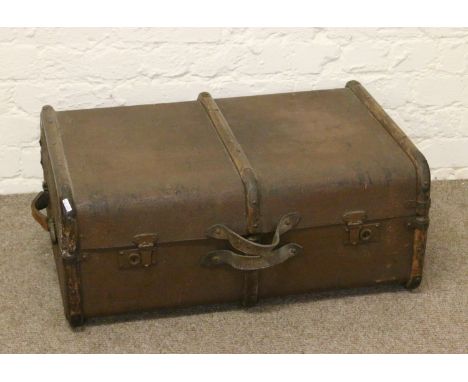 A metal bound travel trunk.