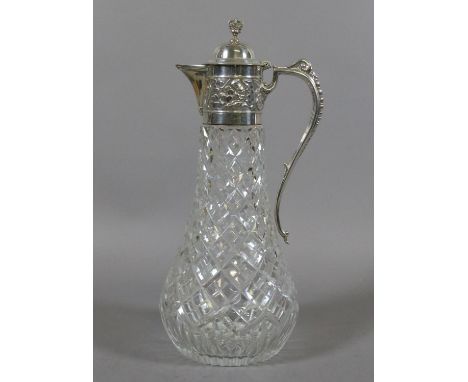 A cut glass and silver mounted silver jubilee claret jug by Aspreys & Co. Ltd with crown finial and chased with thistles, sha