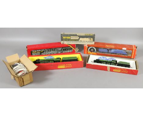 Five boxed OO gauge model railway locomotives to include Hornby and Wrenn examples, along with a power unit.