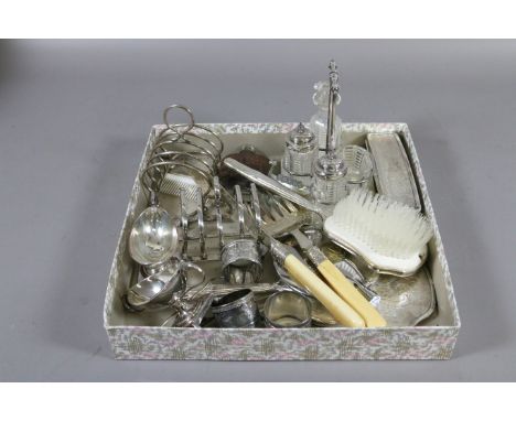 A box of assorted silver plated wares including cruet set, toast racks and hip flask etc.