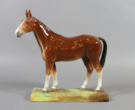 A Royal Doulton model of a chestnut horse raised on an oblong plinth HN2537.