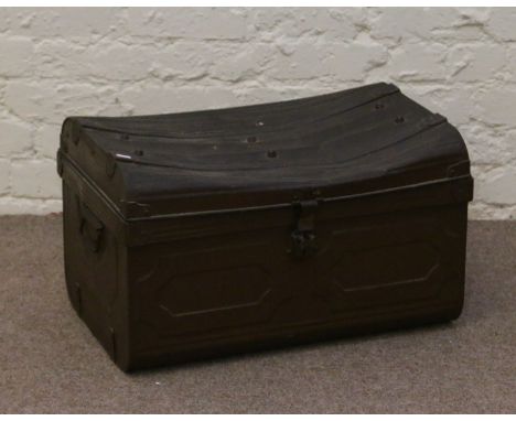 A metal dome top travel trunk.