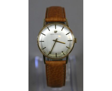 A gentleman's 9ct gold cased Girard Perregau model 17 manual wristwatch with satin dial baton hands and markers, along with a