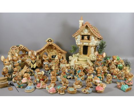 A large collection of Pendelfin stone craft to include The Large House, The Old School House and Toy Shop along with assorted
