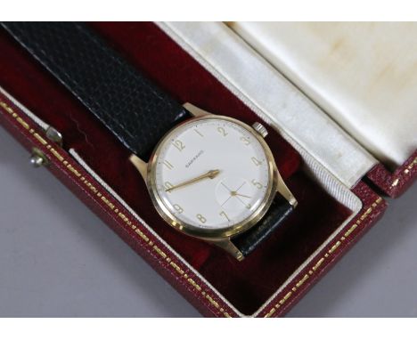 A gentleman's 9ct gold Garrard & Co. Ltd manual wristwatch with applied gilt Arabic numerals and subsidiary seconds, presenta