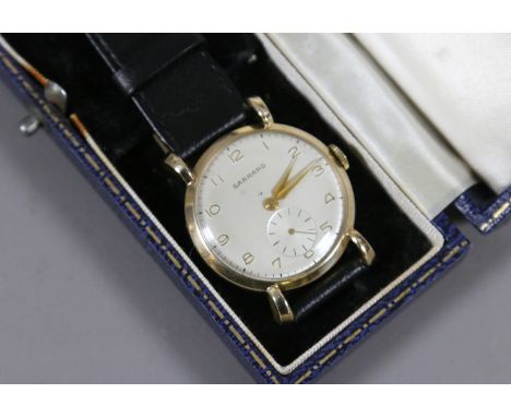A gentleman's Garrard 9ct gold cased manual wristwatch in original Royal Warrant box with tear drop lugs, satin dial, applied