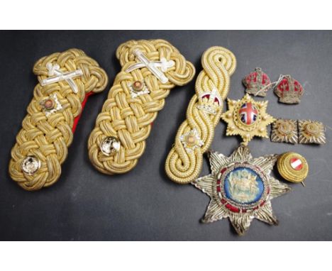 Three gilt thread officer's epaulettes and 7 good pips & badges
