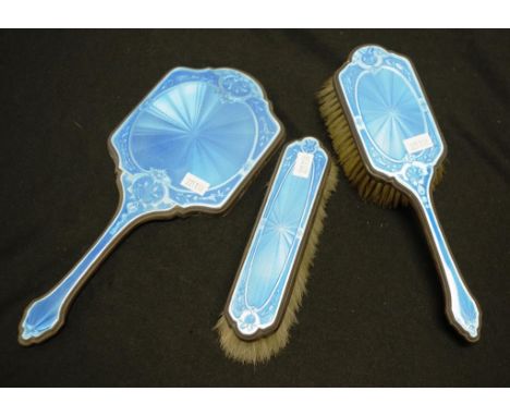 Silver &amp; guilloche enamel dressing table set including: hand mirror, hair brush, and clothes brush, each with blue enamel