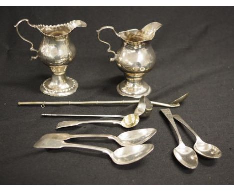 Group seven various sterling silver pieces with various hallmarks, including: a Georg Jensen ladle, 4 various teaspoons, a mu