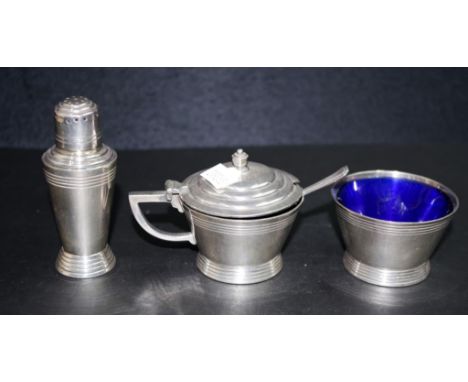 Four piece Art Deco silver plate cruet set comprising an open salt, with blue glass liner; a mustard pot &amp; spoon, with bl