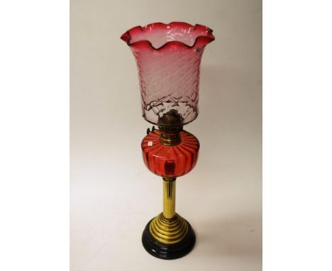 Antique kerosene fuel banquet lamp ruby glass shade and reservoir, double burner, to column form brass base, (height 68cm app