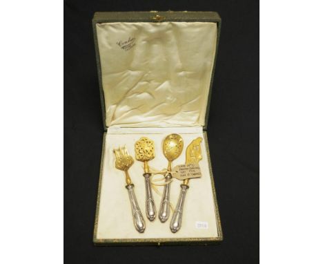 Cased antique French silver &amp; gilt serving pieces each with  embossed handle to gilded point, including serving knife and