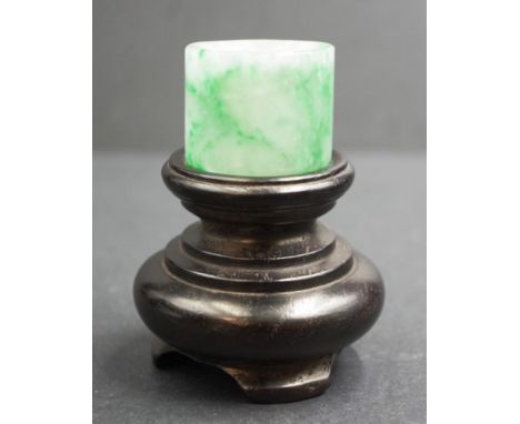 Chinese green jade archer's ring (31mm diameter x 25mm) on turned wood stand, total height 7cm approx