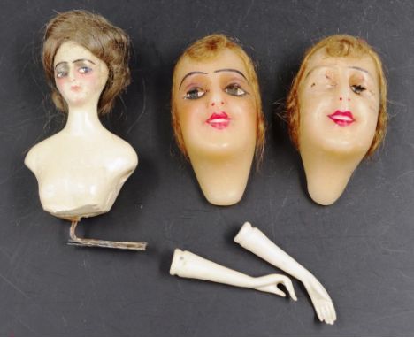 Group early waxed model faces &amp; a half doll including: 2 waxed model faces of women, (height 7cm approx, each); and a cer