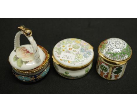 Two various English decorated enamel caskets including: Crummies lidded blossom decorated casket, (diameter 6cm approx); and 