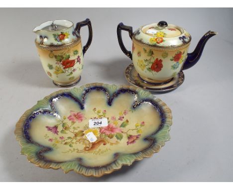 A Carlton Ware Floral Pattern Tea Service.