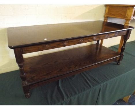 A Rectangular Coffee Table with Stretcher Shelf.