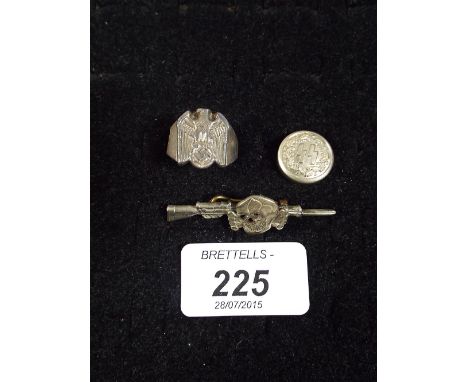 A Nazi Prisoner of War Ring, Death Skull Rifle Brooch and SS Button. 