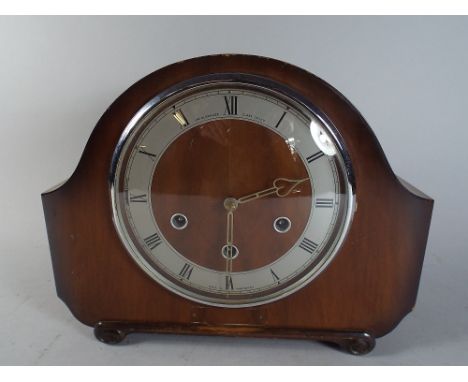 A Westminster Chime Walnut Cased Mantle Clock by The Alexander Clarke Co Limited.