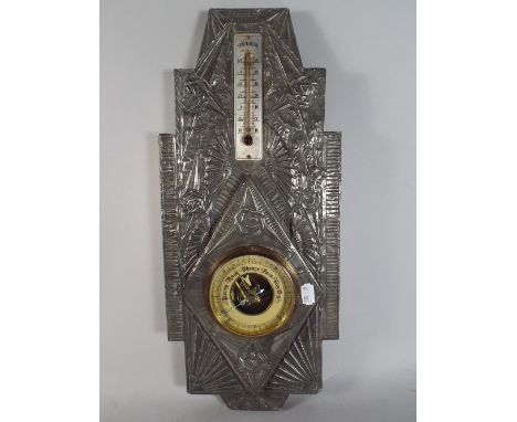 A French White Metal Mounted Barometer/Thermometer.