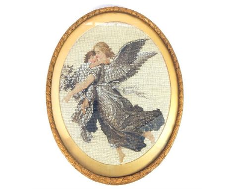 A 19th century oval Berlin woolwork panel, embroidered with a pair of angels, in an oval gilt frame, 