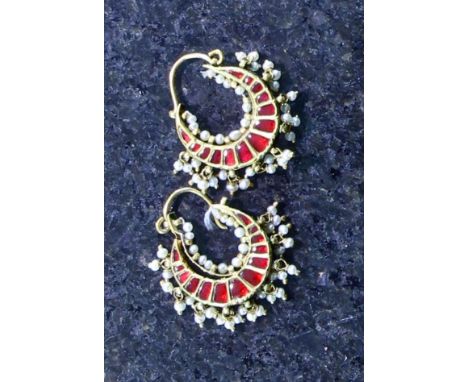 A pair of antique Indian hoop earrings, the crescent shaped bodies in high carat yellow gold, each set with thirteen irregula