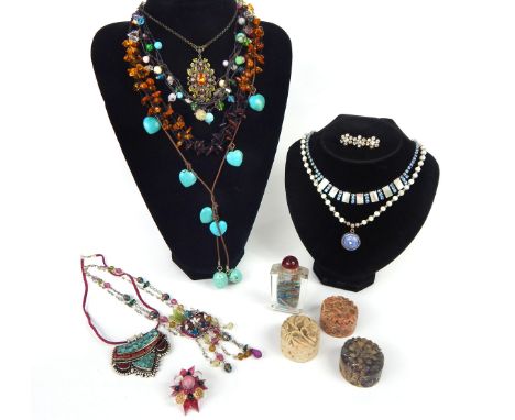 A large quantity of vintage and costume jewellery, including a variety of gem-set necklaces and pendants alongside three hand