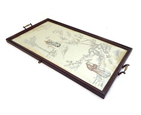 A C19th Chinese embroidered silk panel depicting two figures travelling through a landscape, set in a mahogany tray with bras
