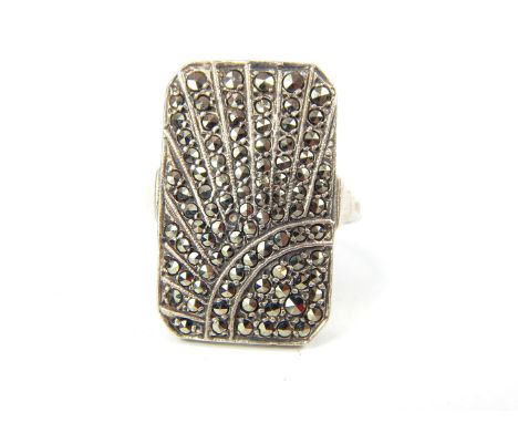 A silver and marcasite Art Deco style ring, the central, rectangular panel depicting a radiating sunburst motif (size R), Wei