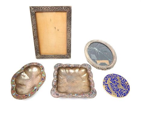 A silver gilt and blue enamel circular cloak brooch, two silver and enamel pin trays (possibly Persian), and two silver photo