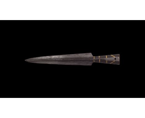 9th-11th century AD. An iron spearhead with slender triangular blade and pronounced midrib, short octagonal-section socket, i