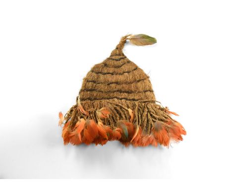 Inca, 14th-15th century AD. A child's cap, possibly from a Qhapaq hucha sacrifice, made from woven wool with bands of dark br