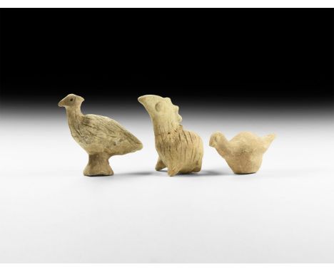 3rd-2nd millennium BC. A mixed group of ceramic animals, each a rattle. 221 grams, 90-95cm (3 1/2 - 3 3/4"). From a German co