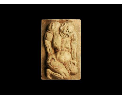 Song Dynasty, 960-1279 AD. A rectangular ceramic tile with high relief figure of one of the Nio guardian deities, hair pulled