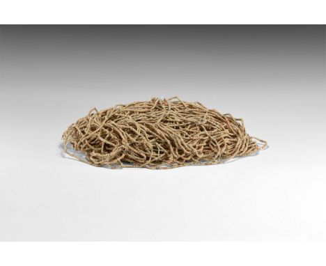 4th century AD or later. A large group of restrung necklaces, multiple strands of small ceramic beads, in buff, red and brown