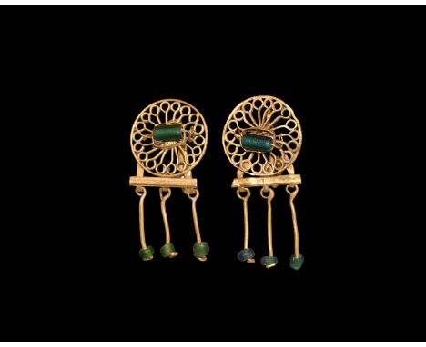 2nd century AD and later. A matched pair of gold earrings, one ancient and a later copy; each a filigree roundel with radiati