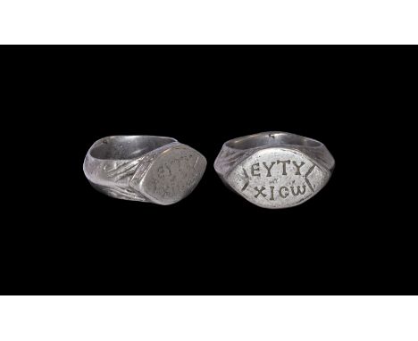 5th-6th century AD. A silver finger ring comprising a cusped D-section hoop with geometric detailing, scaphoid bezel with S-s