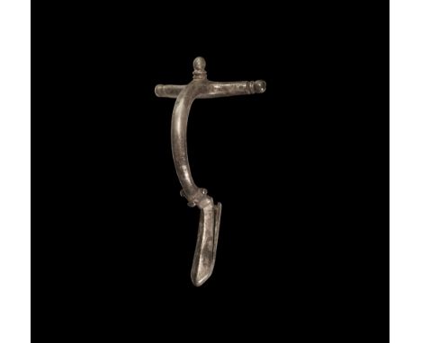 3rd century AD. A silver crossbow brooch with three balustered knops, deep bow with three radiating knops to the collar, tong